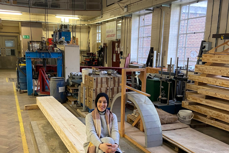 Dr Tahreer Fayyad sitting in an engineering lab